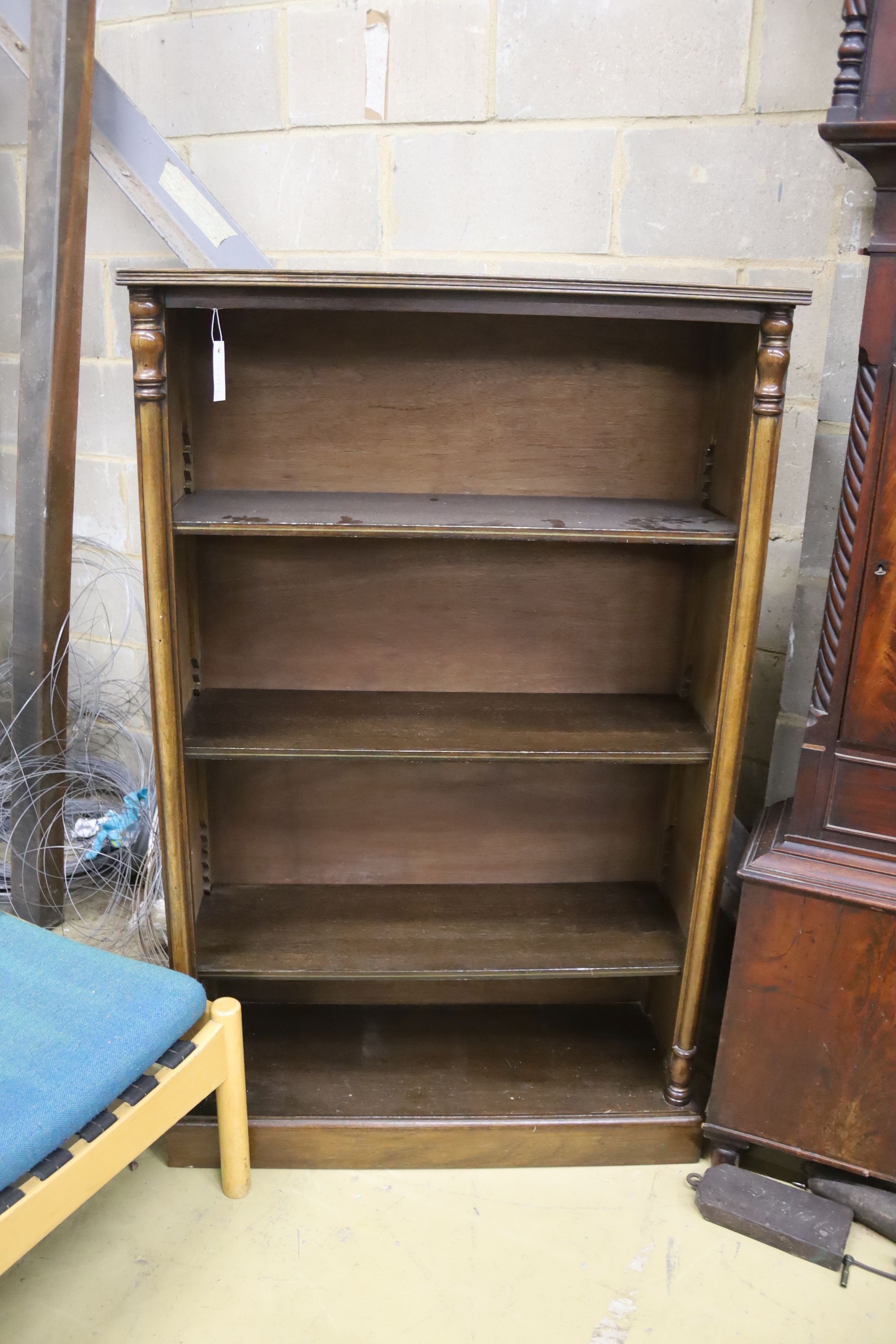 A reproduction Victorian style mahogany open fronted bookcase, length 82cm, depth 30cm, height 132cm